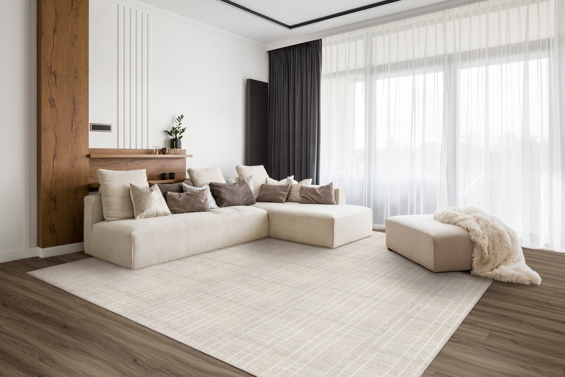 San Martino in Sand made into a large area rug under a cream sectional sofa, on a dark wood floor